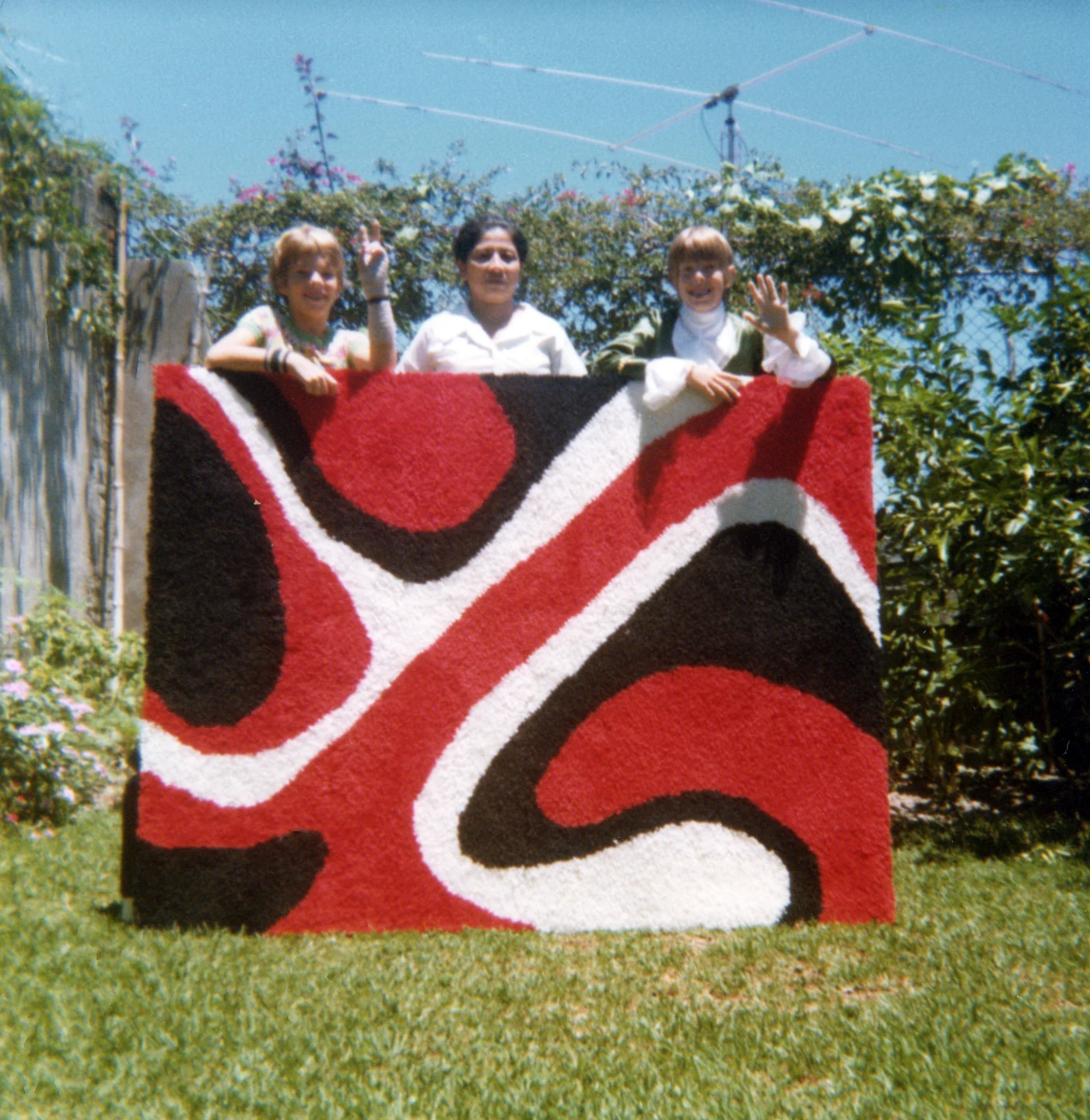 Martin, Martha, and Matthew with rug