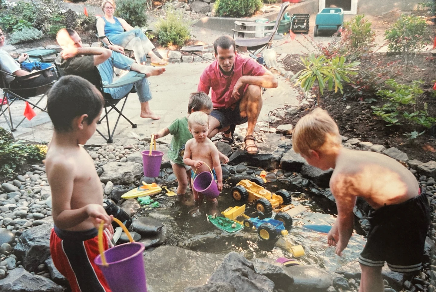 Marcus, Alex, Noah, and Josh playing in the pond 2002
